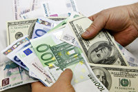 Курс американской валюты к евро снижается на данных из США и на ожиданиях запроса финпомощи Испанией